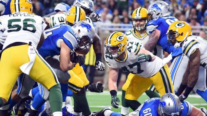 Jan 1, 2017; Detroit, MI, USA; Detroit Lions fullback Zach Zenner (34) scores a touchdown during the second quarter against the Green Bay Packers at Ford Field. Mandatory Credit: Tim Fuller-USA TODAY Sports