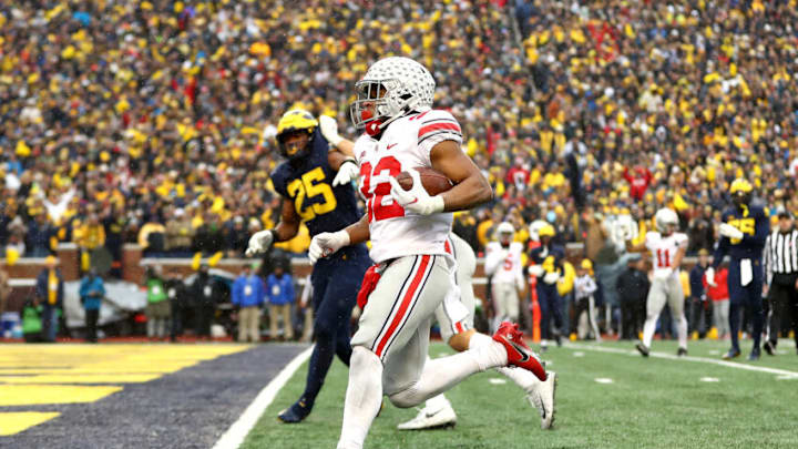 ANN ARBOR, MICHIGAN - NOVEMBER 27: TreVeyon Henderson #32 of the Ohio State Buckeyes carries the ball for a touchdown in the second half of the game against the Michigan Wolverines at Michigan Stadium on November 27, 2021 in Ann Arbor, Michigan. (Photo by Mike Mulholland/Getty Images) ANN ARBOR, MICHIGAN - NOVEMBER 27: TreVeyon Henderson #32 of the Ohio State Buckeyes carries the ball for a touchdown in the second half of the game against the Michigan Wolverines at Michigan Stadium on November 27, 2021 in Ann Arbor, Michigan. (Photo by Mike Mulholland/Getty Images)