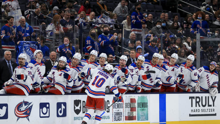 Jan 27, 2022; Columbus, Ohio, USA; New York Rangers left wing Artemi Panarin (10) celebrates with teammates on the bench after scoring a goal against the Columbus Blue Jackets in the first period at Nationwide Arena. Mandatory Credit: Aaron Doster-USA TODAY Sports