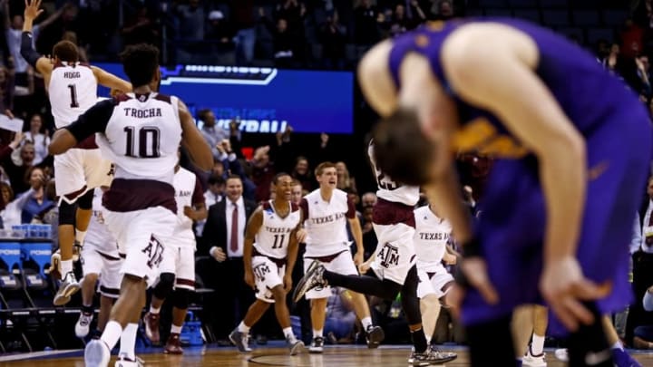 Mar 20, 2016; Oklahoma City, OK, USA; Northern Iowa Panthers forward Klint Carlson (2) reacts as Texas A&M Aggies players celebrate the victory after the game in the second round of the 2016 NCAA Tournament at Chesapeake Energy Arena. Mandatory Credit: Kevin Jairaj-USA TODAY Sports