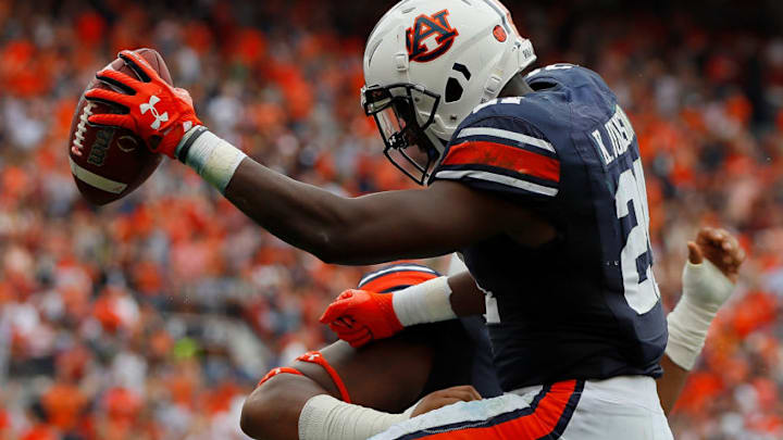 AUBURN, AL - OCTOBER 07: Kerryon Johnson No. 21 of the Auburn Tigers reacts after scoring a touchdown against the Mississippi Rebels with Darius James No. 78 at Jordan Hare Stadium on October 7, 2017 in Auburn, Alabama. (Photo by Kevin C. Cox/Getty Images)