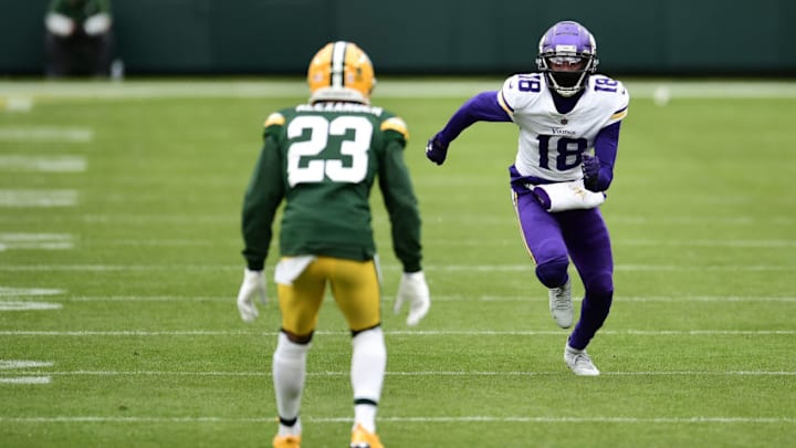 GREEN BAY, WISCONSIN - NOVEMBER 01: Justin Jefferson #18 of the Minnesota Vikings works against Jaire Alexander #23 of the Green Bay Packers during a game at Lambeau Field on November 01, 2020 in Green Bay, Wisconsin. The Vikings defeated the Packers 28-22. (Photo by Stacy Revere/Getty Images)