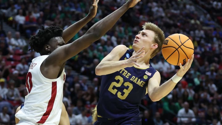 SAN DIEGO, CALIFORNIA – MARCH 18: Dane Goodwin #23 of the Notre Dame Fighting Irish goes up for a layup against Charles Bediako #10 of the Alabama Crimson Tide during the first half in the first round game of the 2022 NCAA Men’s Basketball Tournament at Viejas Arena at San Diego State University on March 18, 2022 in San Diego, California. (Photo by Sean M. Haffey/Getty Images)