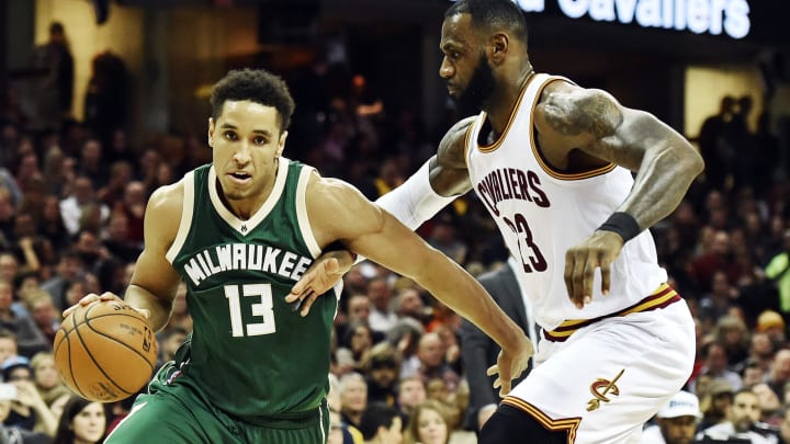 Dec 21, 2016; Cleveland, OH, USA; Milwaukee Bucks guard Malcolm Brogdon (13) drives to the basket against Cleveland Cavaliers forward LeBron James (23) during the second half at Quicken Loans Arena. The Cavs won 113-102. Mandatory Credit: Ken Blaze-USA TODAY Sports