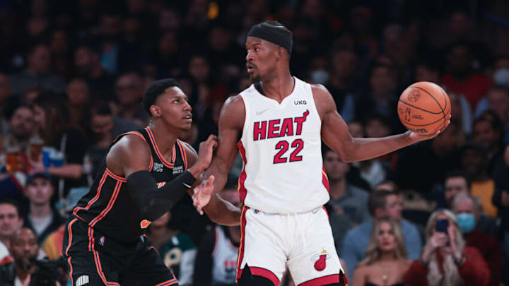 Feb 25, 2022; New York, New York, USA; Miami Heat forward Jimmy Butler (22) shields the ball from New York Knicks guard RJ Barrett (9) during the second half at Madison Square Garden. Mandatory Credit: Vincent Carchietta-USA TODAY Sports