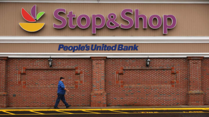 WESTPORT, CONNECTICUT - APRIL 20: Striking Stop & Shop workers walk through an empty parking lot outside of one of the grocery stores on April 20, 2019 in Westport, Connecticut. Negotiations between Stop & Shop officials and the striking United Food and Commercial Workers (UFCW) union Resumed on Sunday. The union, which represents 31,000 striking employees, is trying to settle a dispute over proposed changes to health care benefits and employee pay. (Photo by Spencer Platt/Getty Images)