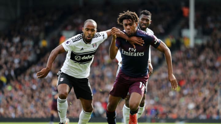 LONDON, ENGLAND - OCTOBER 07: Alex Iwobi of Arsenal battles for possession with Denis Odoi of Fulham during the Premier League match between Fulham FC and Arsenal FC at Craven Cottage on October 7, 2018 in London, United Kingdom. (Photo by Bryn Lennon/Getty Images)