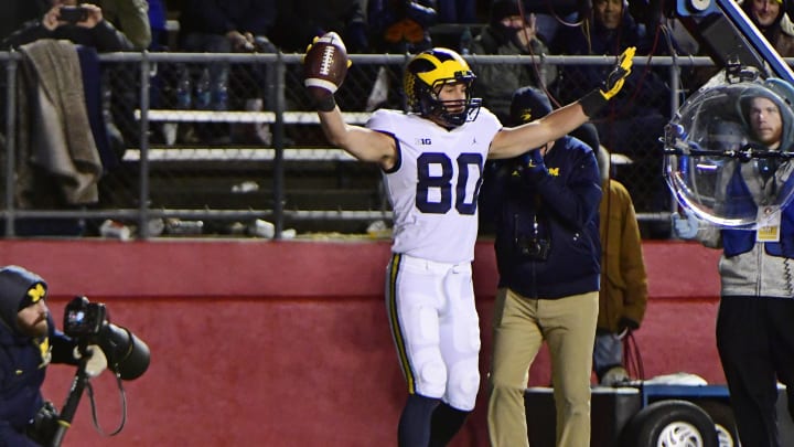 PISCATAWAY, NJ – NOVEMBER 10: Oliver Martin #80 of the Michigan Wolverines scores a touchdown against the Rutgers Scarlet Knights during the third quarter at HighPoint.com Stadium on November 10, 2018 in Piscataway, New Jersey. Michigan won 42-7. (Photo by Corey Perrine/Getty Images)