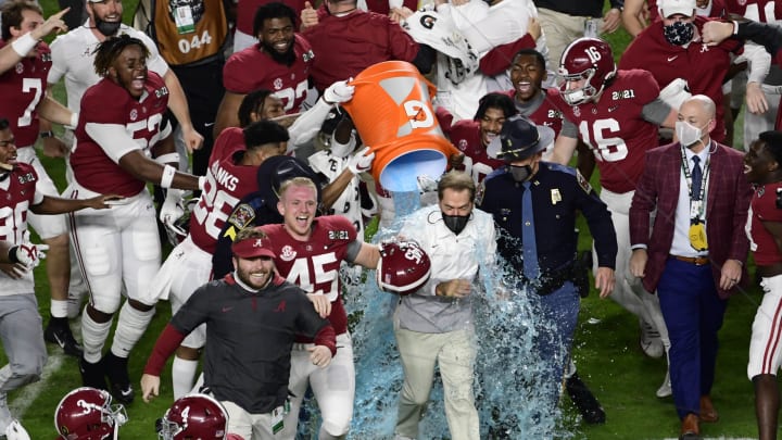 Jan 11, 2021; Miami Gardens, FL, USA; Alabama Crimson Tide head coach Nick Saban is dunked with Gatorade after defeating the Ohio State Buckeyes in the 2021 College Football Playoff National Championship Game at Hard Rock Stadium. Mandatory Credit: Douglas DeFelice-USA TODAY Sports