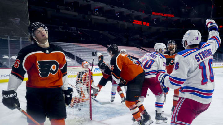 PHILADELPHIA, PENNSYLVANIA - FEBRUARY 24: Joel Farabee #86 of the Philadelphia Flyers and Ryan Strome #16 of the New York Rangers react following a goal by Chris Kreider #20 of the New York Rangers during the second period at Wells Fargo Center on February 24, 2021 in Philadelphia, Pennsylvania. (Photo by Tim Nwachukwu/Getty Images)