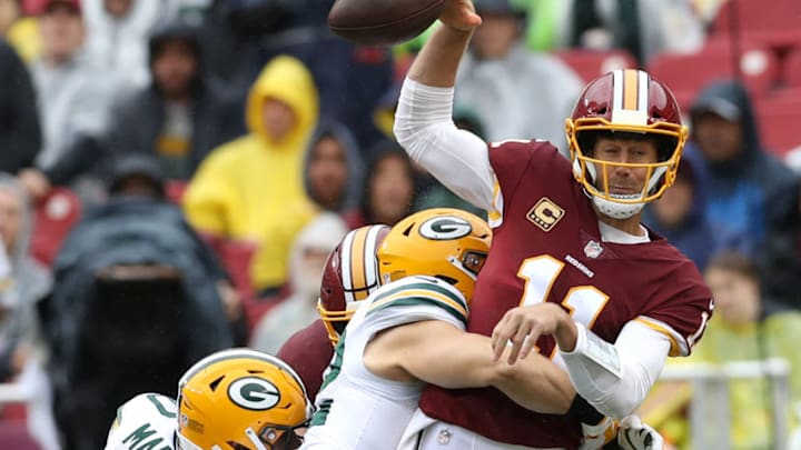 LANDOVER, MD - SEPTEMBER 23: Clay Matthews #52 of the Green Bay Packers hits quarterback Alex Smith #11 of the Washington Redskins in the first half at FedExField on September 23, 2018 in Landover, Maryland. (Photo by Rob Carr/Getty Images)