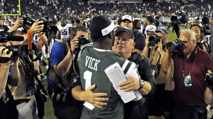 Aug 28, 2014; Philadelphia, PA, USA; New York Jets quarterback Michael Vick (1) and Philadelphia Eagles head coach Chip Kelly meet on field after game at Lincoln Financial Field. The Eagles defeated the Jets, 37-7. Mandatory Credit: Eric Hartline-USA TODAY Sports