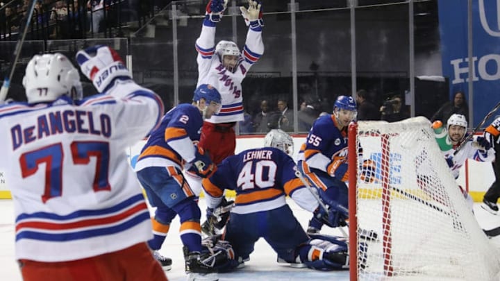 NEW YORK, NEW YORK - JANUARY 12: Chris Kreider #20 of the New York Rangers celebrates the game winning goal by Mats Zuccarello #36 (far right) at 14:55 of the third period against Robin Lehner #40 of the New York Islanders at the Barclays Center on January 12, 2019 in the Brooklyn borough of New York City. The Rangers defeated the Islanders 3-2. (Photo by Bruce Bennett/Getty Images)