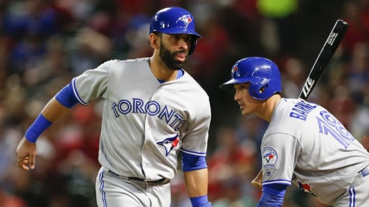 May 13, 2016; Arlington, TX, USA; Toronto Blue Jays right fielder Jose Bautista (19) celebrates his run with second baseman Darwin Barney (18) against the Texas Rangers at Globe Life Park in Arlington. The Blue Jays won 5-0. Mandatory Credit: Jim Cowsert-USA TODAY Sports