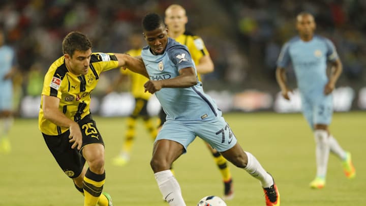 SHENZHEN, CHINA - JULY 28: Kelechi Iheanacho (R) of Manchester City contests the ball against Sokratis Papastathopoulos of Borussia Dortmund during the 2016 International Champions Cup match between Manchester City and Borussia Dortmund at Shenzhen Universiade Stadium on July 28, 2016 in Shenzhen, China. (Photo by Lintao Zhang/Getty Images)