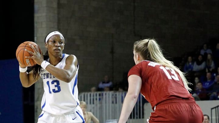 Jan 7, 2016; Lexington, KY, USA; Kentucky Wildcats forward Evelyn Akhator (13) passes the ball against Alabama Crimson Tide forward Nikki Hegstetter (13) in the second half at Memorial Coliseum. Kentucky defeated Alabama 73-48. Mandatory Credit: Mark Zerof-USA TODAY Sports