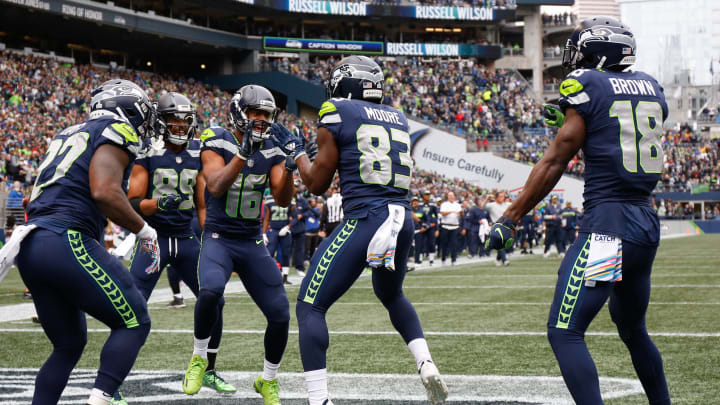 SEATTLE, WA – OCTOBER 07: Wide Receiver Tyler Lockett #16 of the Seattle Seahawks celebrates a touchdown with teammates in the first half against the Los Angeles Rams at CenturyLink Field on October 7, 2018 in Seattle, Washington. (Photo by Otto Greule Jr/Getty Images)