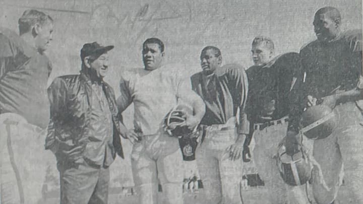 April 30, 1967; Lansing, MI: Spartan football coach Duffy Daugherty (second from left) is surrounded by top backfield candidates. Four of the five are expected to start in this fall. From left are Frank Waters, Bob Apisa, Jimmy Raye, Reggie Cavender and Dwight Lee. Mandatory Credit: State Journal Photo-USA TODAY NETWORK