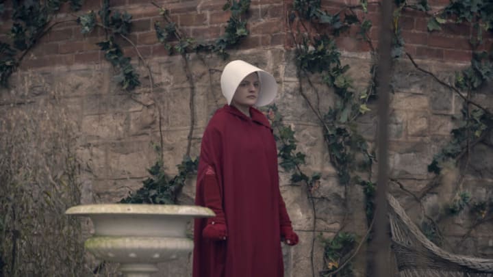 The Handmaid's Tale -- "Mary and Martha" - Episode 302 -- June helps Marthas with a dangerous task while navigating a relationship with her pious and untrustworthy new walking partner. Emily and Luke struggle with their altered circumstances. June (Elizabeth Moss), shown. (Photo by: Elly Dassas/Hulu)