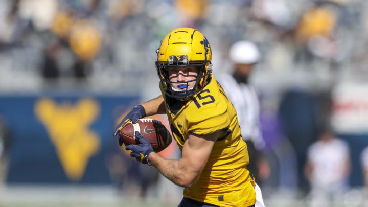 Oct 31, 2020; Morgantown, West Virginia, USA; West Virginia Mountaineers wide receiver Reese Smith (15) catches a pass during the second quarter against the Kansas State Wildcats at Mountaineer Field at Milan Puskar Stadium. Mandatory Credit: Ben Queen-USA TODAY Sports