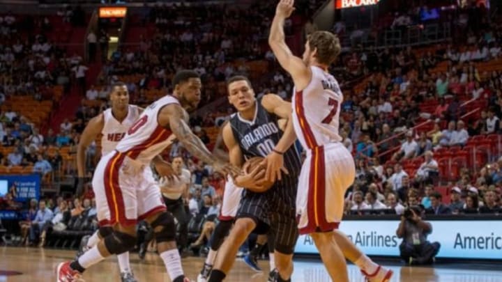 Apr 13, 2015; Miami, FL, USA; Orlando Magic forward Aaron Gordon (00) is being defended by Miami Heat guard Goran Dragic (7) during the first half at American Airlines Arena. Mandatory Credit: Steve Mitchell-USA TODAY Sports