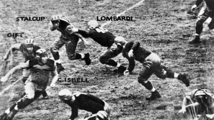 Fordham University guard Vince Lombardi (40) pursues the Purdue ballcarrier during a game circa the mid-1930. Lombardi famously would coach the Green Bay Packers to five World Championships in seven years--including the first two Super Bowls. Also pictured playing for Purdue is Cecil Isbell (88) who would play for Green Bay in the late 1930s and early 1940s before ending his career with the New York Giants. (Photo by Fordham University/Getty Images)