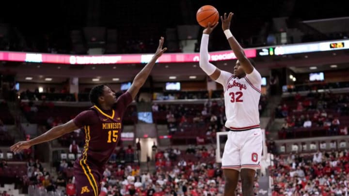 Ohio State Buckeyes forward E.J. Liddell (32) shoots a three pointer over Minnesota Golden Gophers forward Charlie Daniels (15) during the second half of the NCAA men's basketball game at Value City Arena in Columbus on Tuesday, Feb. 15, 2022. Ohio State won 70-45.Minnesota Golden Gophers At Ohio State Buckeyes Men S Basketball
