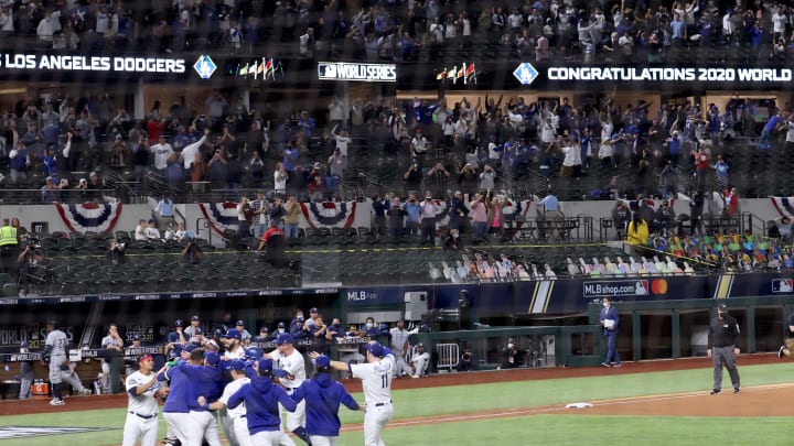 The Los Angeles Dodgers celebrate on the field after winning the World Series.