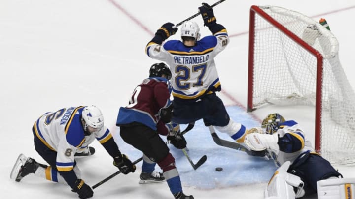 DENVER, CO - APRIL 07: Colorado Avalanche right wing Sven Andrighetto #10 splits St. Louis Blues defenseman Joel Edmundson #6 and St. Louis Blues defenseman Alex Pietrangelo #27 and goes after the puck against St. Louis Blues goaltender Jake Allen #34 in the second period at the Pepsi April 07, 2018. (Photo by Andy Cross/The Denver Post via Getty Images)