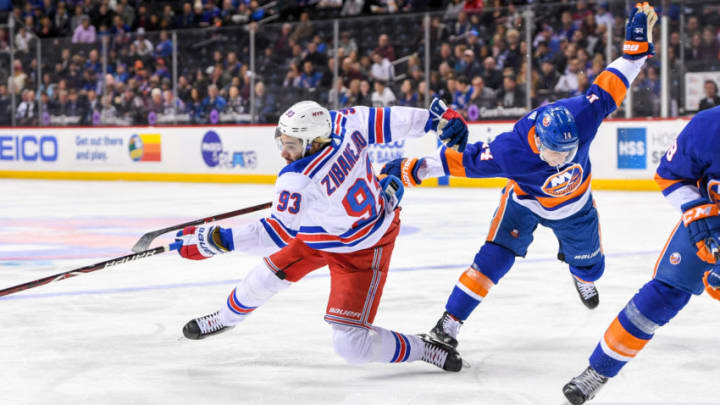 BROOKLYN, NY - APRIL 05: New York Rangers Center Mika Zibanejad (93) and New York Islanders Defenceman Thomas Hickey (14) collide with each other during the first period at the Barclays Center in Brooklyn,NY (Photo by Dennis Schneidler/Icon Sportswire via Getty Images)