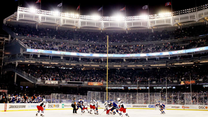 The New York Rangers face off during the 2014 Coors Light NHL Stadium Series at Yankee Stadium on January 29, 2014(Photo by Elsa/Getty Images)
