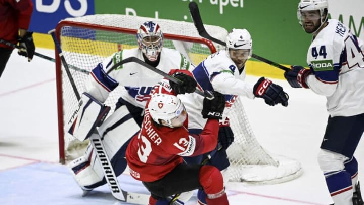 USA's goalkeeper Jeremy Swayman (L), USA's defender Seth Jones and USA's defender Jaycob Megna vie with Switzerland's forward Nico Hischier (2L) during the IIHF Ice Hockey World Championships quarter-final match between Switzerland and United States in Helsinki, Finland, on May 26, 2022. - - Finland OUT (Photo by Emmi Korhonen / LEHTIKUVA / AFP) / Finland OUT (Photo by EMMI KORHONEN/LEHTIKUVA/AFP via Getty Images)