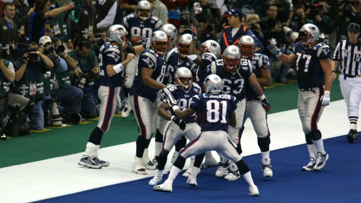 03 Feb 2002: David Patten #86 of the New England Patriots celebrates a touchdown against the St.Louis Rams with his teammates during Superbowl XXXVI at the Superdome in New Orleans, Louisiana. The Patriots defeated the Rams 20-17. DIGITAL IMAGE. Mandatory Credit: Al Bello/Getty Images