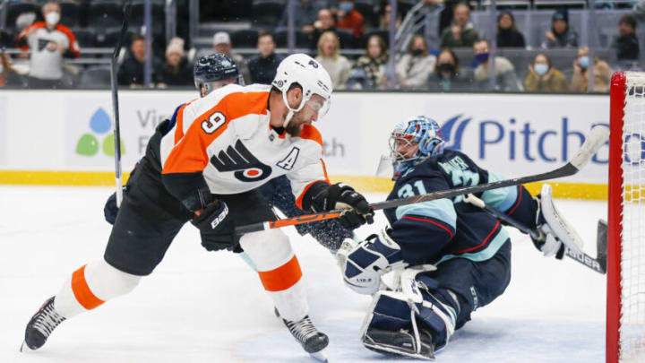 Dec 29, 2021; Seattle, Washington, USA; Philadelphia Flyers defenseman Ivan Provorov (9) scores a goal against Seattle Kraken goaltender Philipp Grubauer (31) during overtime at Climate Pledge Arena. Mandatory Credit: Joe Nicholson-USA TODAY Sports