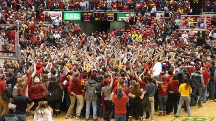 Jan 18, 2016; Ames, IA, USA; Iowa State Cyclone fans rush the court after the Cyclones beat the Oklahoma Sooners at James H. Hilton Coliseum. The Cyclones beat the Sooners 82-77. Mandatory Credit: Reese Strickland-USA TODAY Sports