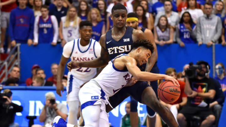 LAWRENCE, KANSAS - NOVEMBER 19: Devon Dotson #1 of the Kansas Jayhawks drives to the basket around Bo Hodges #3 of the East Tennessee State Buccaneers during the second half at Allen Fieldhouse on November 19, 2019 in Lawrence, Kansas. (Photo by Ed Zurga/Getty Images)