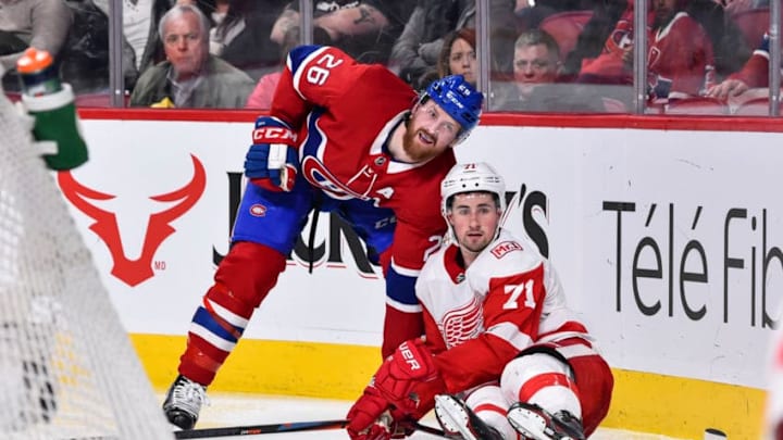MONTREAL, QC - MARCH 26: Jeff Petry #26 of the Montreal Canadiens takes down Dylan Larkin #71 of the Detroit Red Wings during the NHL game at the Bell Centre on March 26, 2018 in Montreal, Quebec, Canada. The Montreal Canadiens defeated the Detroit Red Wings 4-2. (Photo by Minas Panagiotakis/Getty Images)