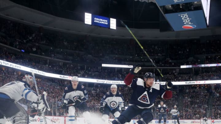 DENVER, CO - APRIL 4: Erik Johnson #6 of the Colorado Avalanche celebrates after scoring the game winning goal against the Winnipeg Jets at the Pepsi Center on April 4, 2019 in Denver, Colorado. The Avalanche defeated the Jets 3-2 in overtime. (Photo by Michael Martin/NHLI via Getty Images)
