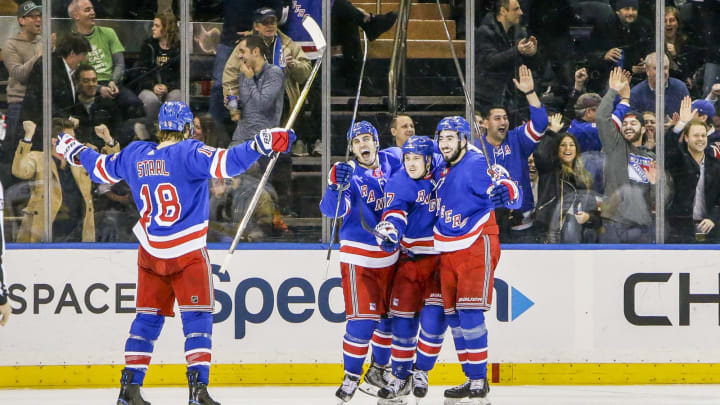 NEW YORK, NY – MARCH 14: Rangers players celebrate goal with fans during the Pittsburgh Penguins and New York Rangers NHL game on March 14, 2018, at Madison Square Garden in New York, NY. (Photo by John Crouch/Icon Sportswire via Getty Images)