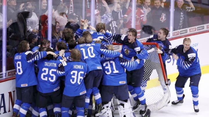 VANCOUVER , BC - JANUARY 5: Team Finland celebrates following a gold medal victory against the United States at the IIHF World Junior Championships at Rogers Arena on January 5, 2019 in Vancouver, British Columbia, Canada. (Photo by Kevin Light/Getty Images)