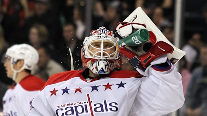 WINNIPEG, CANADA – MARCH 16: Goaltender Tomas Vokoun #29 of the Washington Capitals squirts water on his face during a break in the action in a game against the Winnipeg Jets in NHL action at the MTS Centre on March 16, 2012 in Winnipeg, Manitoba, Canada. (Photo by Marianne Helm/Getty Images)