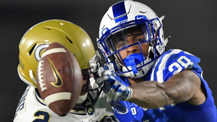 DURHAM, NC – NOVEMBER 18: Mark Gilbert #28 of the Duke Blue Devils breaks up a pass intended for Ricky Jeune #2 of the Georgia Tech Yellow Jackets during their game at Wallace Wade Stadium on November 18, 2017 in Durham, North Carolina. Duke won 43-20. (Photo by Grant Halverson/Getty Images)