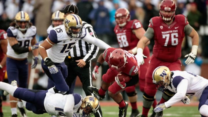 PULLMAN, WA - NOVEMBER 25: Jamal Morrow #25 of the Washington State Cougars carries the ball against the Washington Huskies in the first half of the 109th Apple Cup at Martin Stadium on November 25, 2016 in Pullman, Washington. (Photo by William Mancebo/Getty Images)