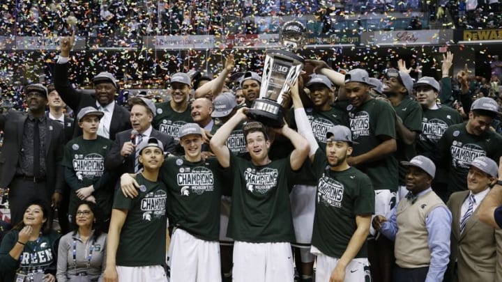 Mar 13, 2016; Indianapolis, IN, USA; Michigan State Spartans celebrate winning the Big Ten Championship against the Purdue Boilermakers during the Big Ten conference tournament at Bankers Life Fieldhouse. Michigan State defeats Purdue 66-62. Mandatory Credit: Brian Spurlock-USA TODAY Sports