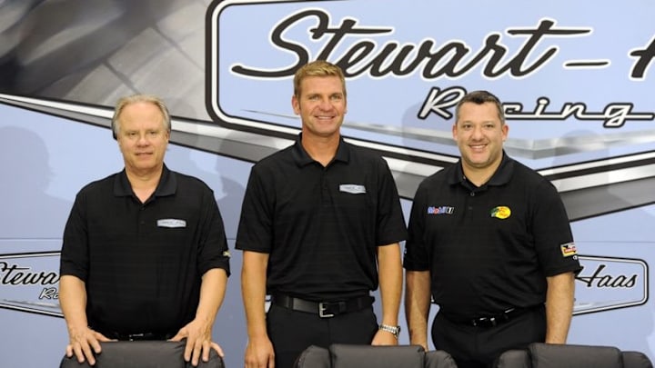 NASCAR Sprint Cup Series and F1 team owner Gene Haas (left) driver Clint Bowyer (center) and Tony Stewart (right) pose for a picture after Tony Stewart announces his retirement at the end of the 2016 season. Mandatory Credit: Sam Sharpe-USA TODAY Sports