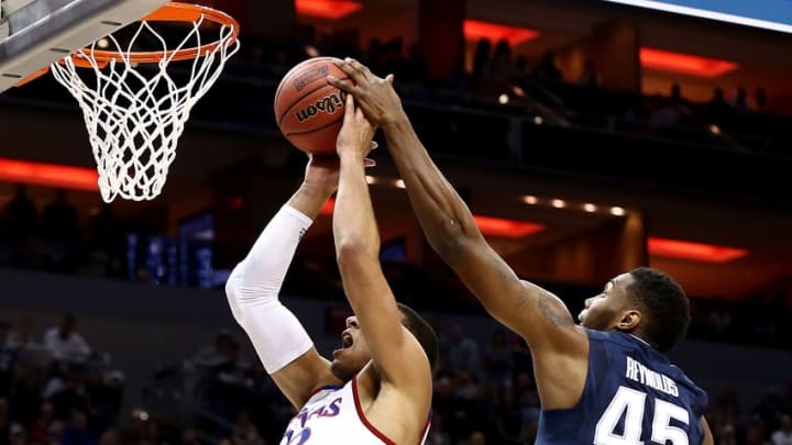 Mar 26, 2016; Louisville, KY, USA; Villanova Wildcats forward Darryl Reynolds (45) and Kansas Jayhawks forward Landen Lucas (33) go after a rebound during the first half of the south regional final of the NCAA Tournament at KFC YUM!. Mandatory Credit: Aaron Doster-USA TODAY Sports