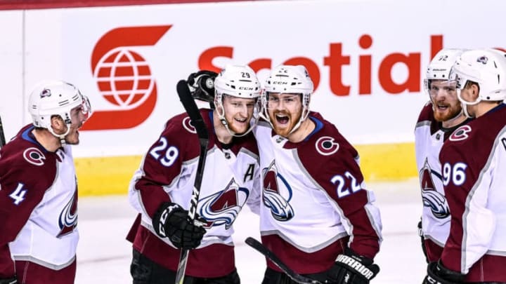 CALGARY, AB - APRIL 19: Colorado Avalanche Winger Colin Wilson (22) celebrates a goal against the Calgary Flames with Colorado Avalanche Center Nathan MacKinnon (29), Defenceman Tyson Barrie (4), Left Wing Gabriel Landeskog (92) and Right Wing Mikko Rantanen (96) during the second period of Game Five of the Western Conference First Round during the 2019 Stanley Cup Playoffs where the Calgary Flames hosted the Colorado Avalanche on April 19, 2019, at the Scotiabank Saddledome in Calgary, AB. (Photo by Brett Holmes/Icon Sportswire via Getty Images)