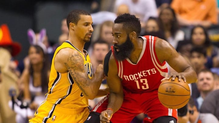 Mar 27, 2016; Indianapolis, IN, USA; Houston Rockets guard James Harden (13) dribbles the ball while Indiana Pacers guard George Hill (3) defends in the first half of the game at Bankers Life Fieldhouse. Mandatory Credit: Trevor Ruszkowski-USA TODAY Sports