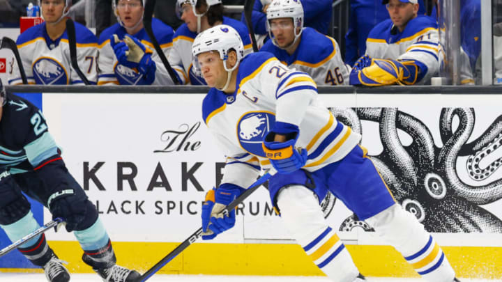 Oct 25, 2022; Seattle, Washington, USA; Buffalo Sabres right wing Kyle Okposo (21) skates with the puck against the Seattle Kraken during the third period at Climate Pledge Arena. Mandatory Credit: Joe Nicholson-USA TODAY Sports