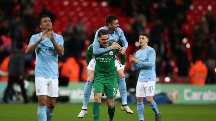 LONDON, ENGLAND - FEBRUARY 25: Aymeric Laporte celebrates with Ederson of Manchester City after the Carabao Cup Final between Arsenal and Manchester City at Wembley Stadium on February 25, 2018 in London, England. (Photo by Catherine Ivill/Getty Images)